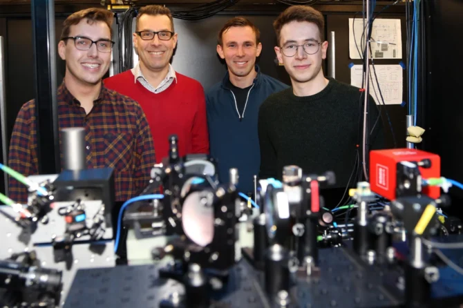 The Tweezer Team at Durham University and their experimental apparatus. From left: Dr. Daniel Ruttley, Prof. Simon Cornish, Dr. Alexander Guttridge, and Mr. Tom Hepworth. Credit: Durham University